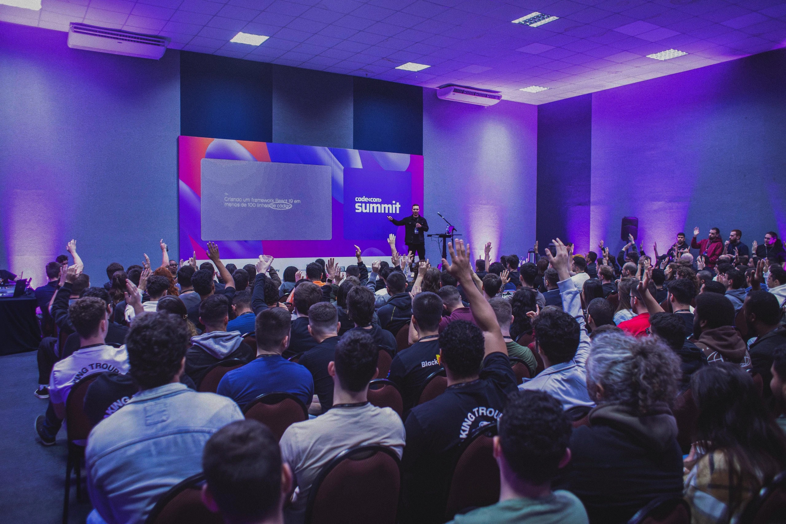 Rafael asking a packed Codecon Summit audience to raise their hands