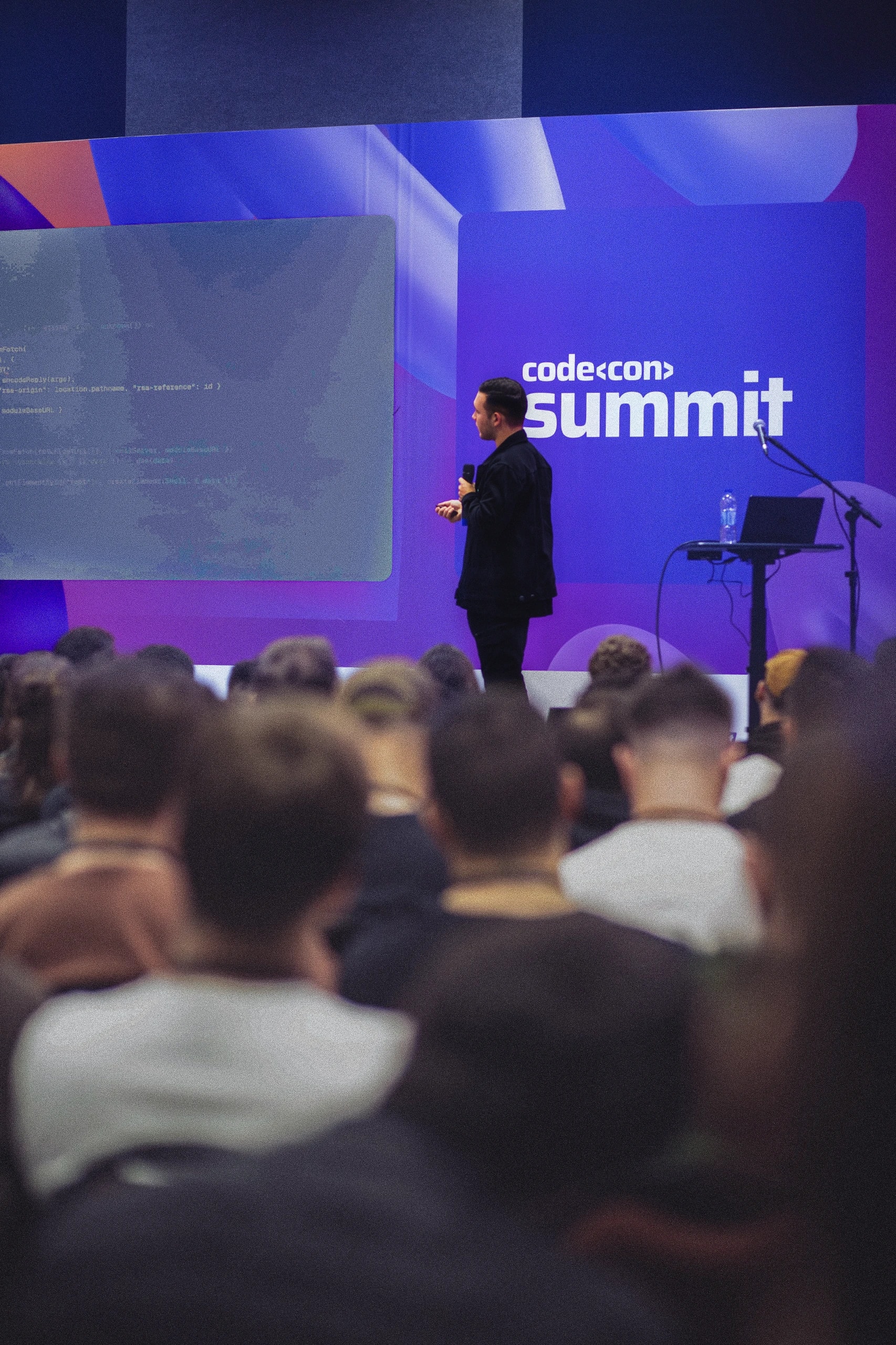 Rafael presenting code on stage at Codecon Summit