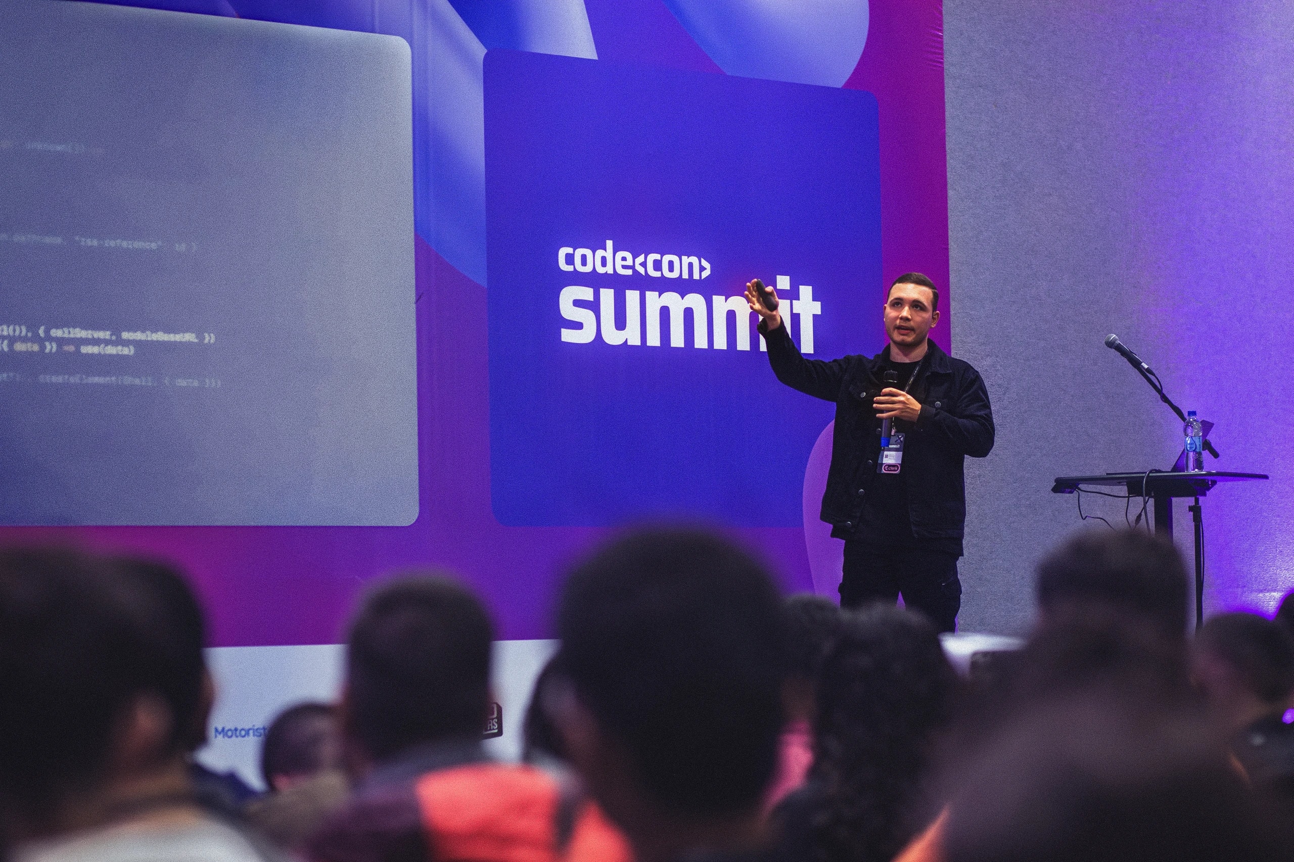 Rafael gesturing while speaking at Codecon Summit